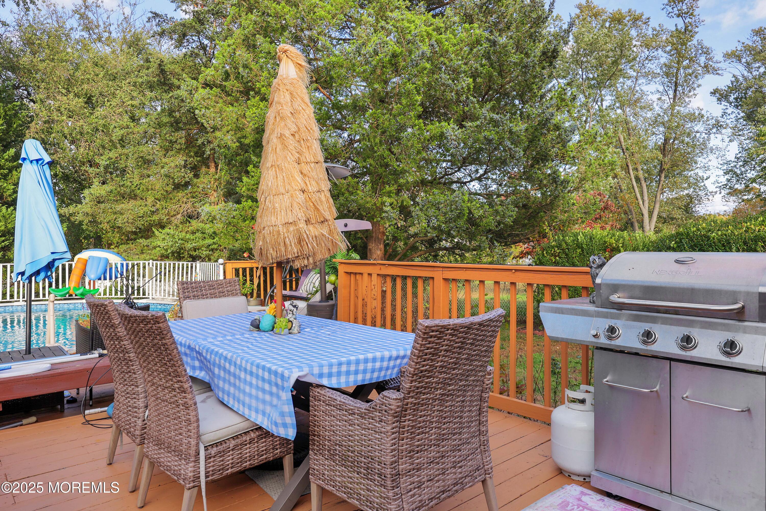 51 Alan Terrace Howell, NJ 07731 - Photo 27 of 32 a view of a patio with a table and chairs