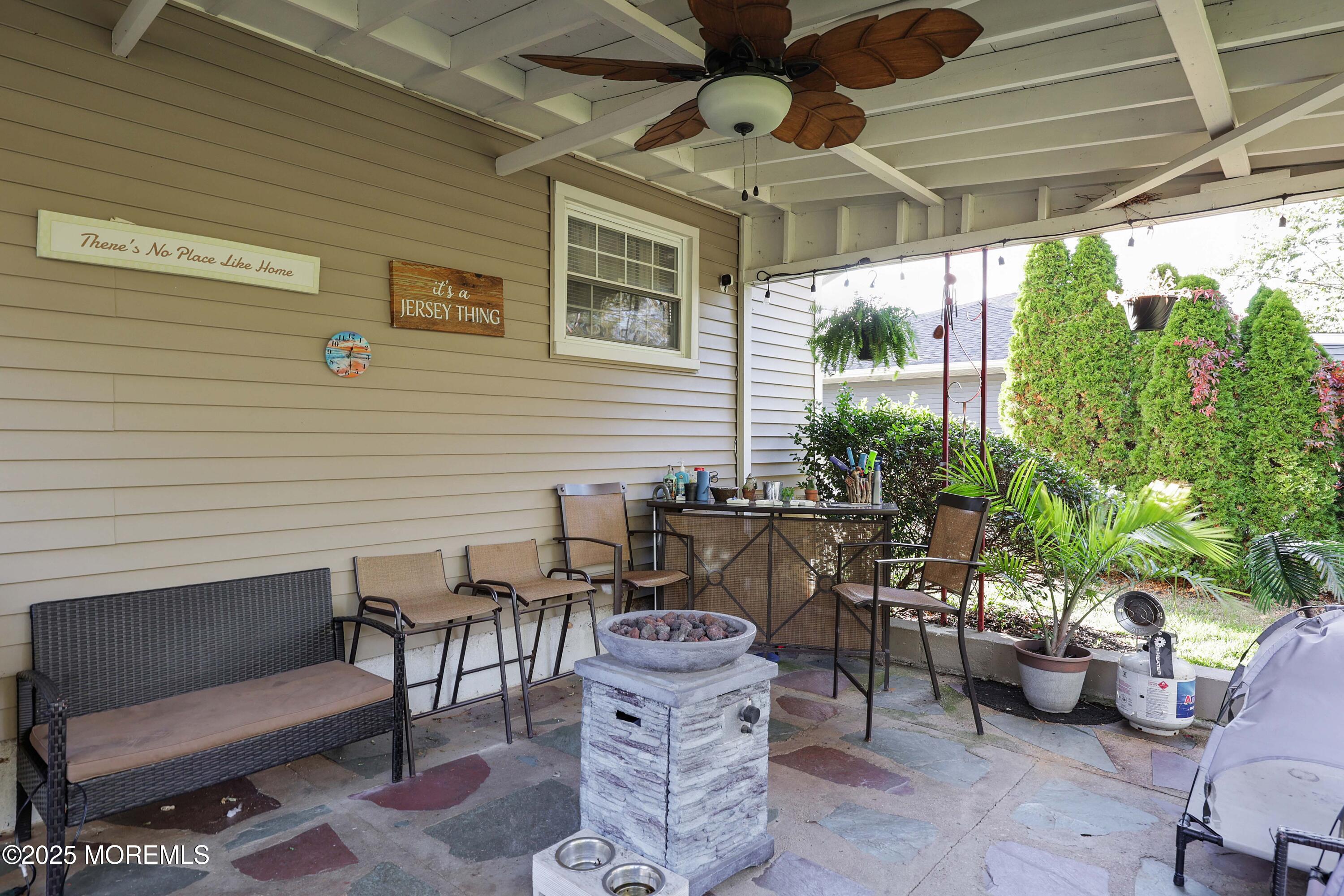 51 Alan Terrace Howell, NJ 07731 - Photo 30 of 32 a view of a patio with couches table and chairs and potted plants