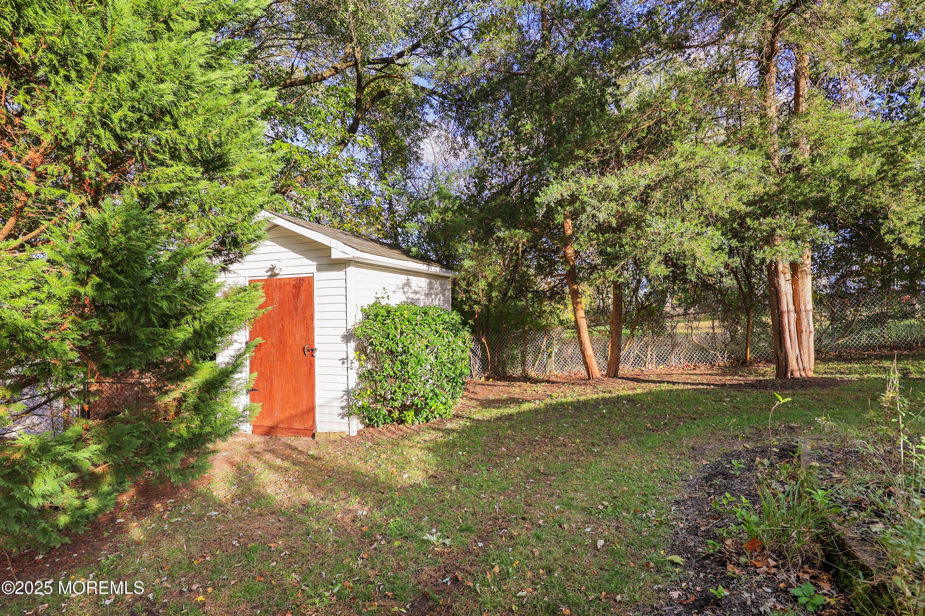 51 Alan Terrace Howell, NJ 07731 - Photo 31 of 32 a view of a back yard with trees
