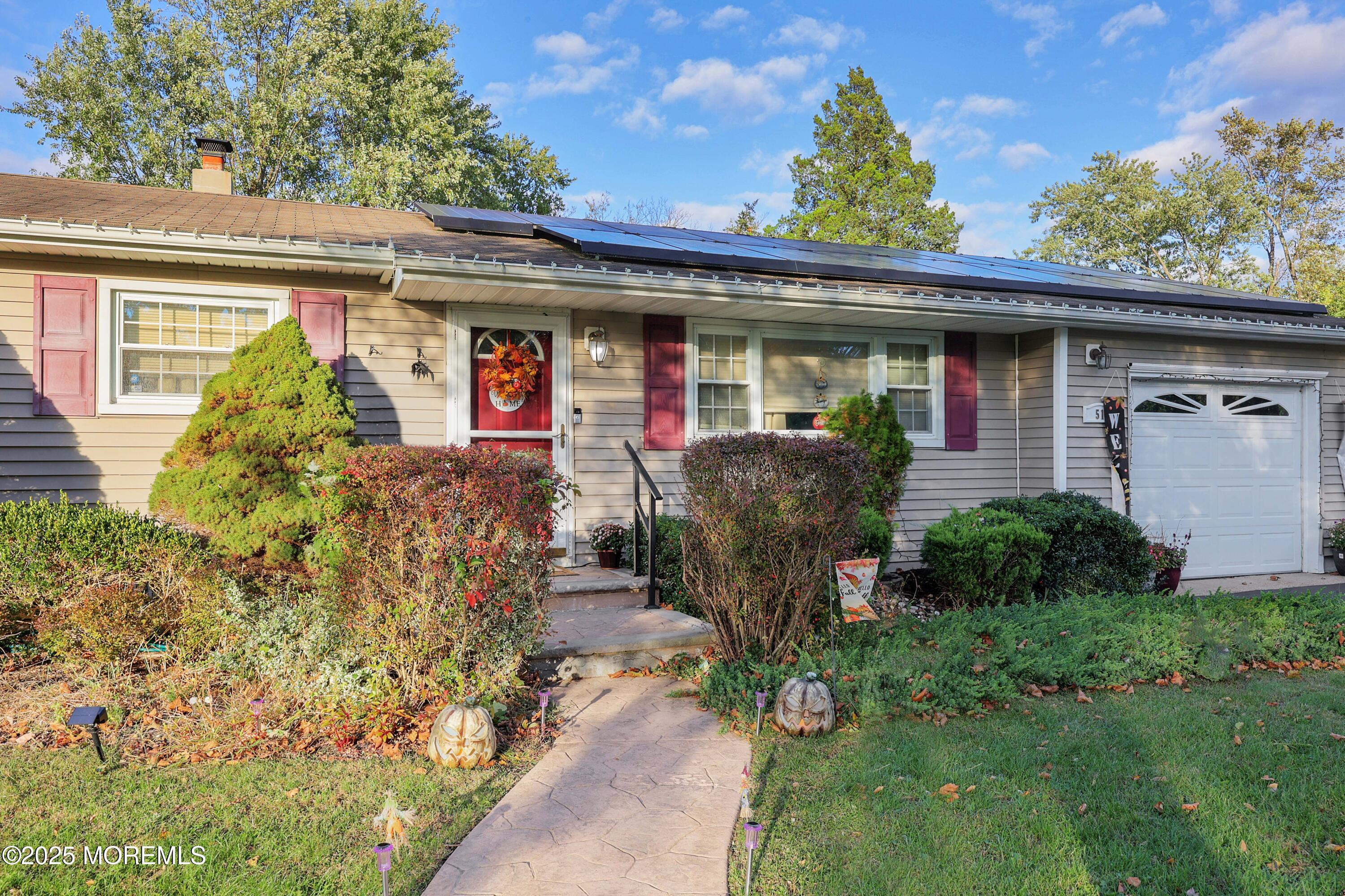 51 Alan Terrace Howell, NJ 07731 - Photo 4 of 32 front view of a house with a small yard