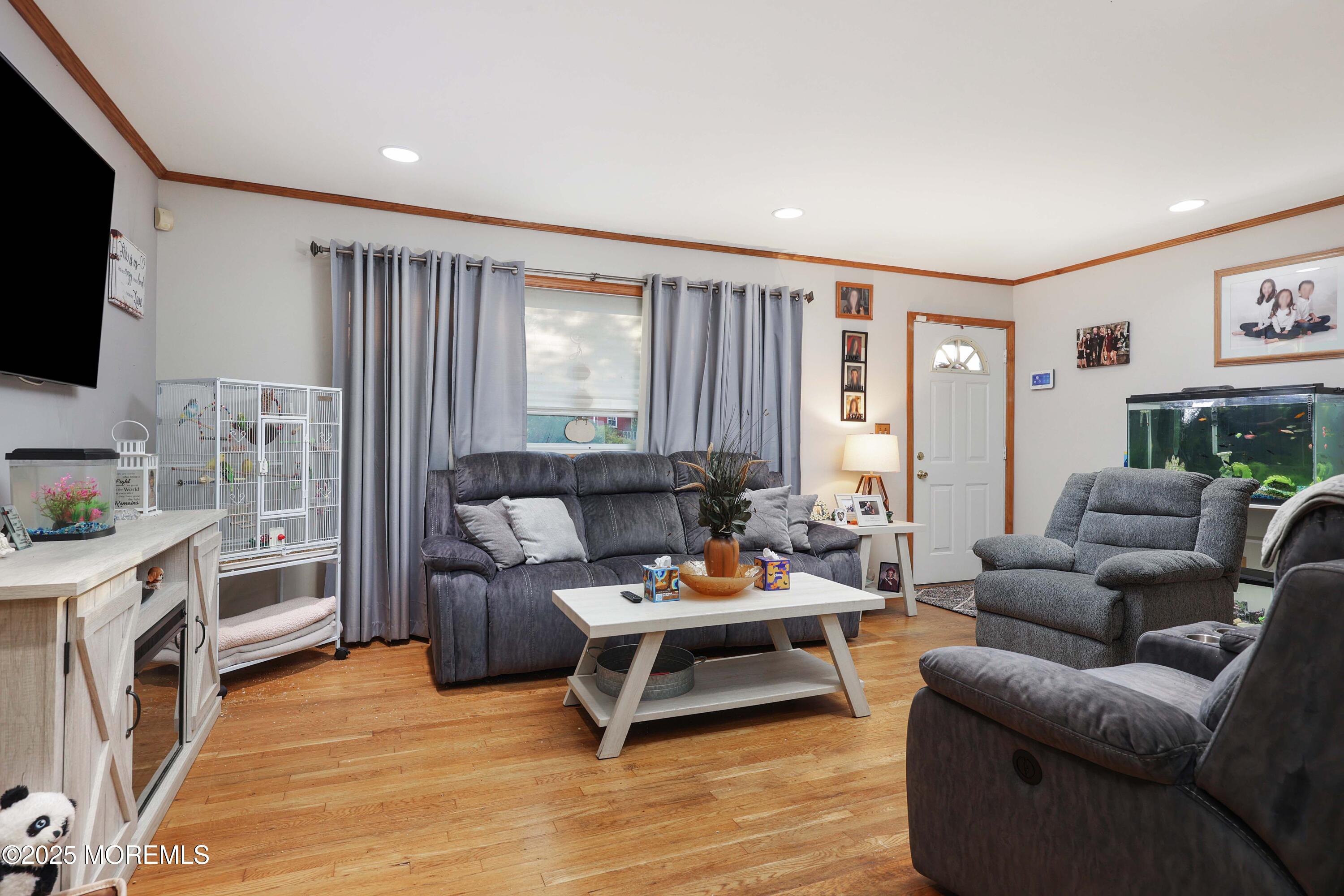 51 Alan Terrace Howell, NJ 07731 - Photo 8 of 32 a living room with furniture and a flat screen tv