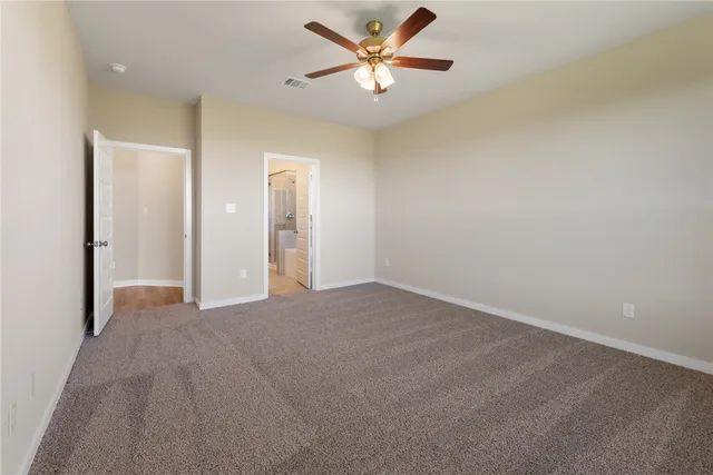 a view of a big room with carpet