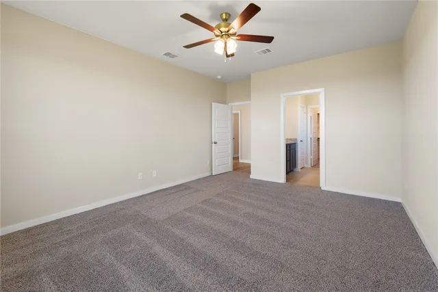 a view of a big room with a ceiling fan and a ceiling fan