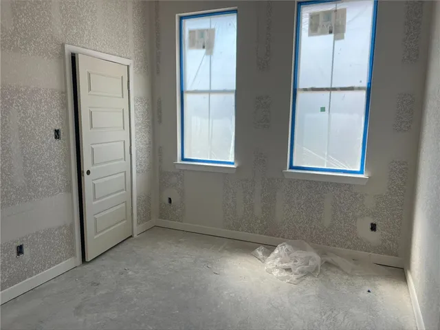 an empty room with windows