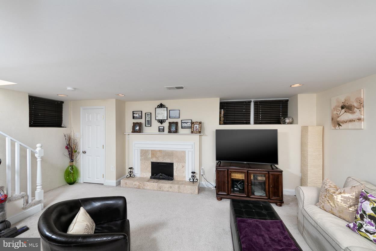 7217 Old Harford Road Baltimore, MD 21234 - Photo 26 of 33 Fully finished lower level with fireplace