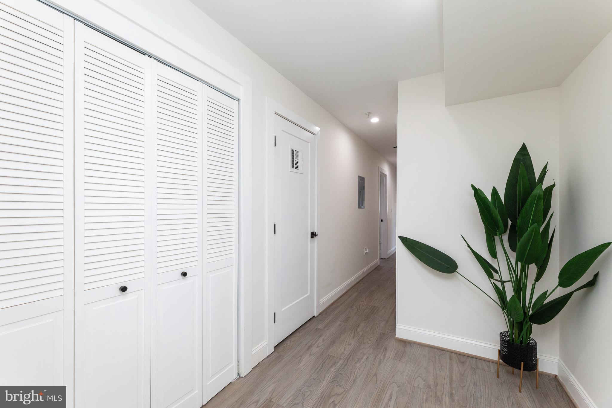 734 Kenyon Street Northwest, Unit 2 Washington, DC 20010 - Photo 12 of 24 a view of a hallway with potted plants