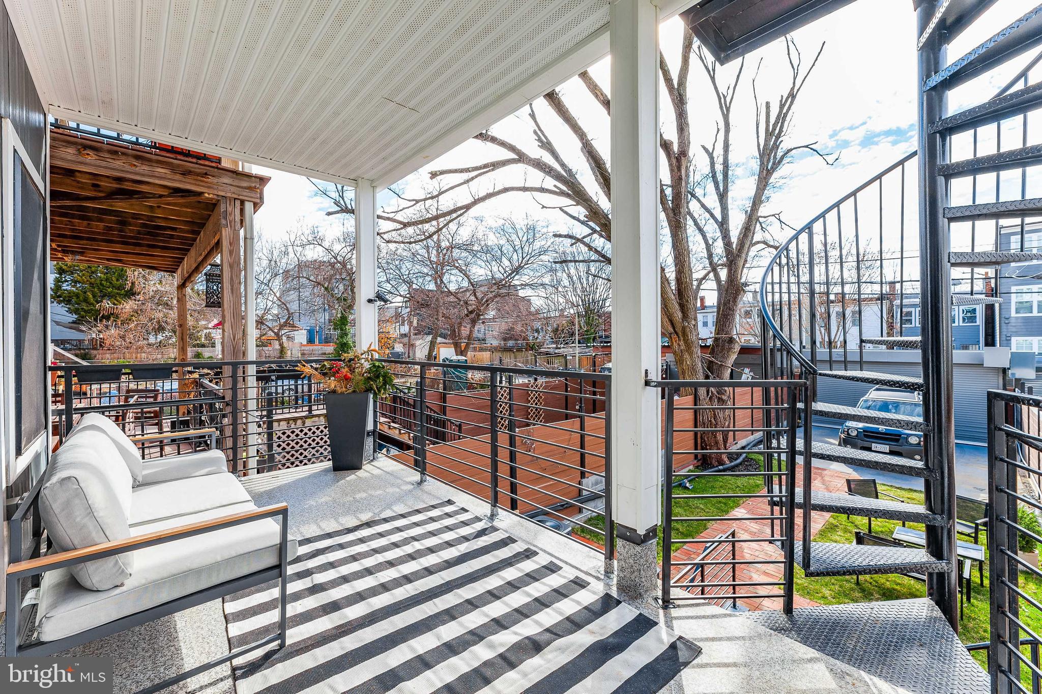 734 Kenyon Street Northwest, Unit 2 Washington, DC 20010 - Photo 18 of 24 a view of a balcony with chairs