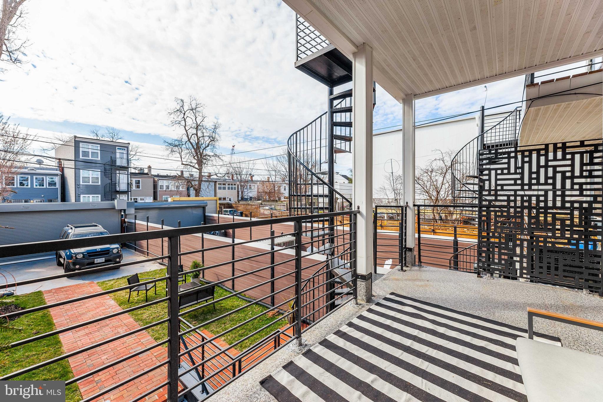 734 Kenyon Street Northwest, Unit 2 Washington, DC 20010 - Photo 19 of 24 a view of a balcony with wooden floor