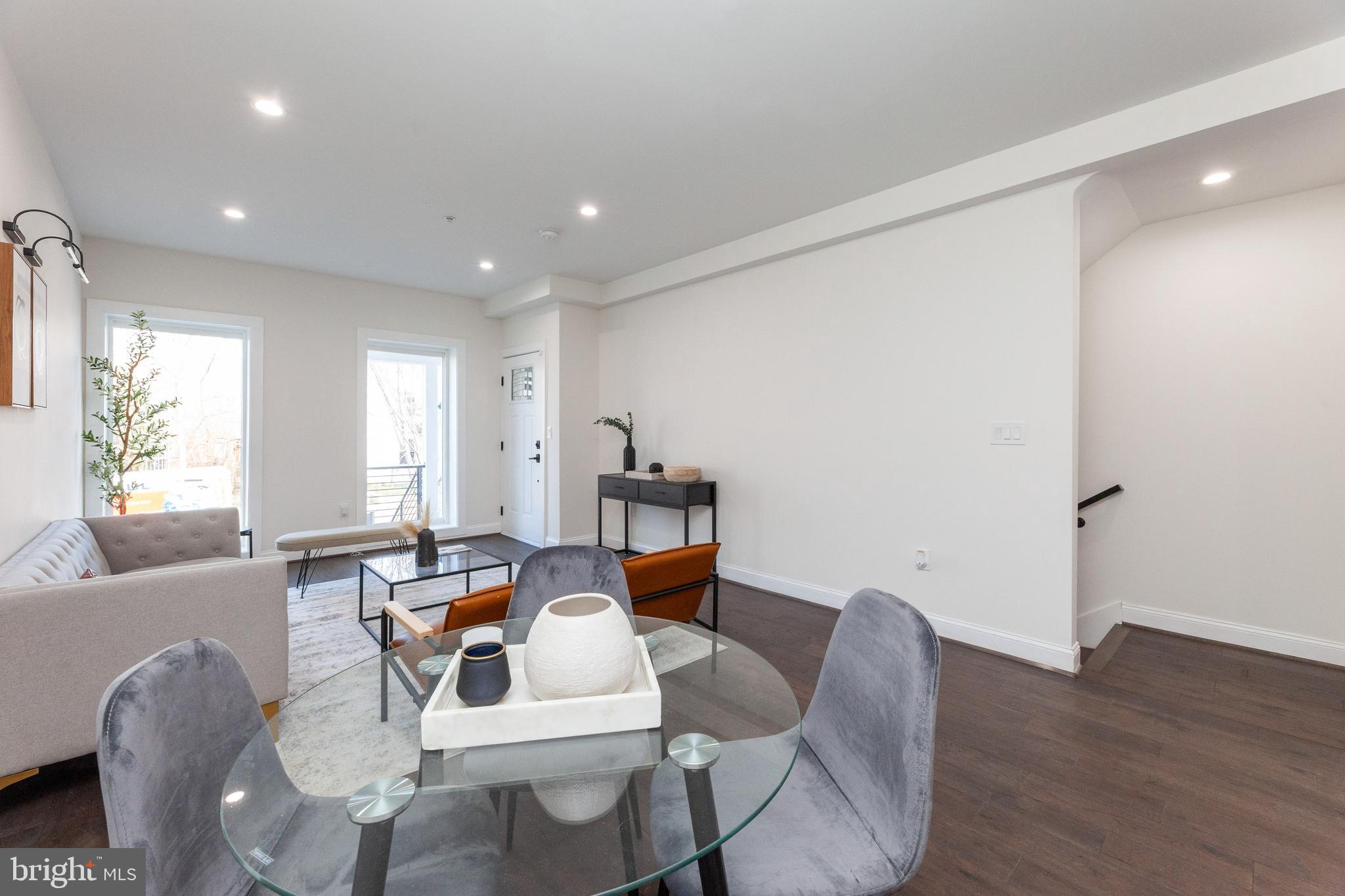 734 Kenyon Street Northwest, Unit 2 Washington, DC 20010 - Photo 2 of 24 a living room with furniture and a wooden floor