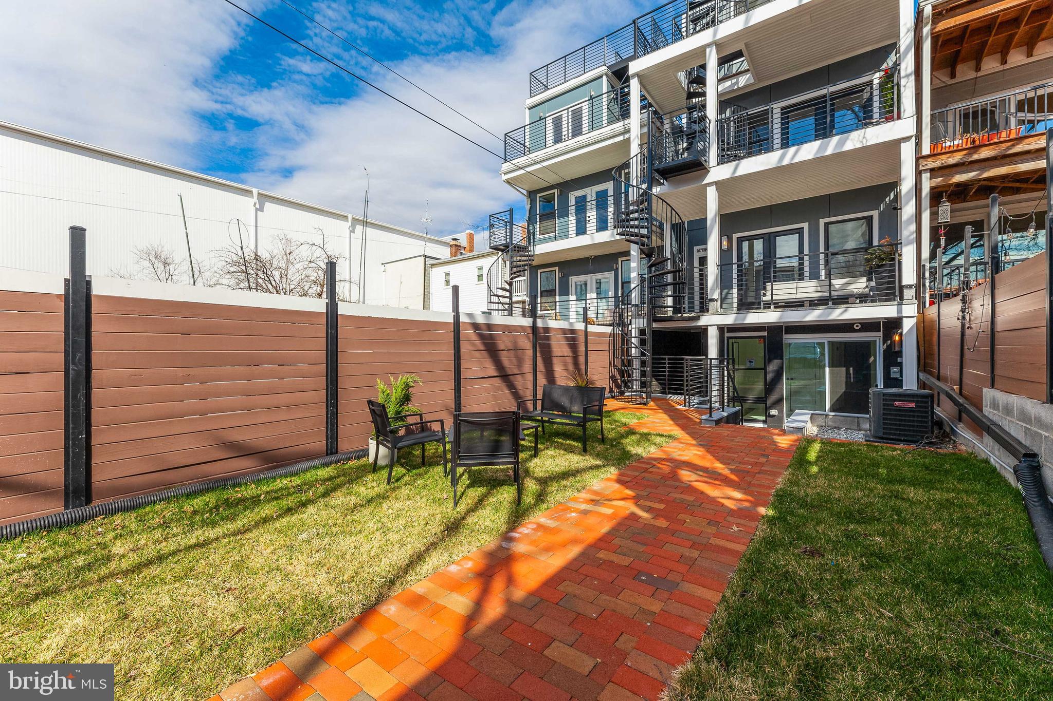 734 Kenyon Street Northwest, Unit 2 Washington, DC 20010 - Photo 23 of 24 a view of a house with backyard and sitting area