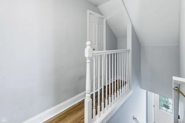 a view of staircase with white walls