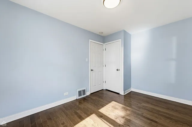 a view of empty room with wooden ceiling