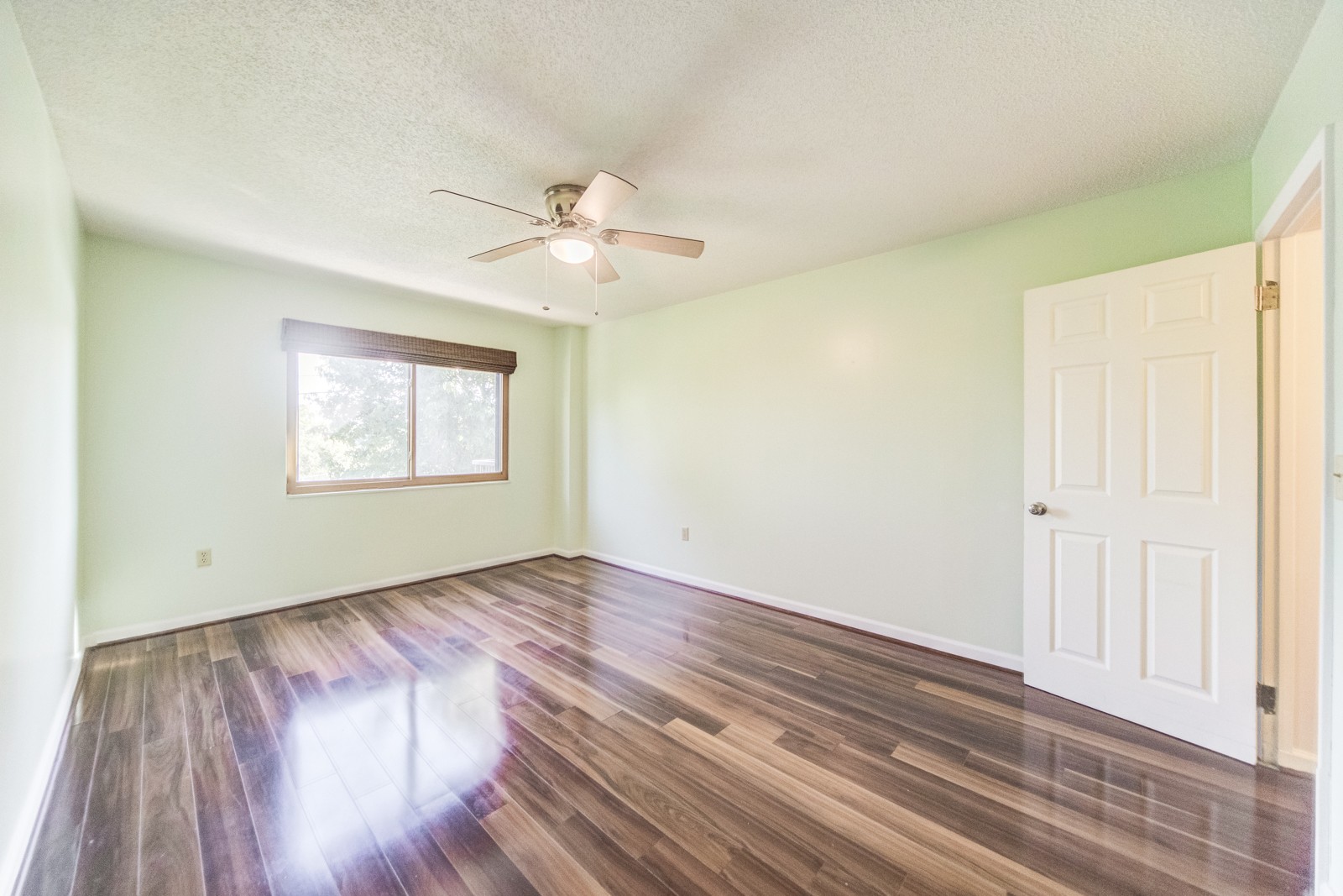 200 Sanders Ferry Road, Unit 1209 Hendersonville, TN 37075 - Photo 14 of 27 an empty room with wooden floor chandelier fan and windows