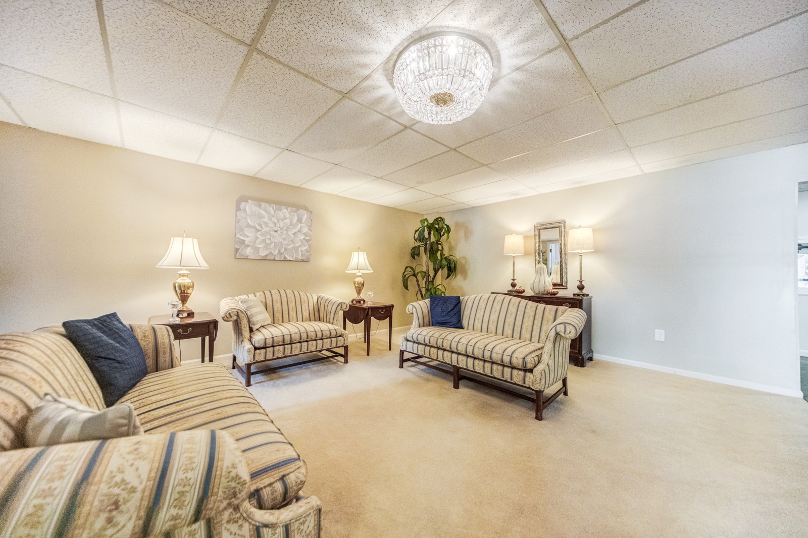 200 Sanders Ferry Road, Unit 1209 Hendersonville, TN 37075 - Photo 22 of 27 a spacious bedroom with a bed and a chandelier