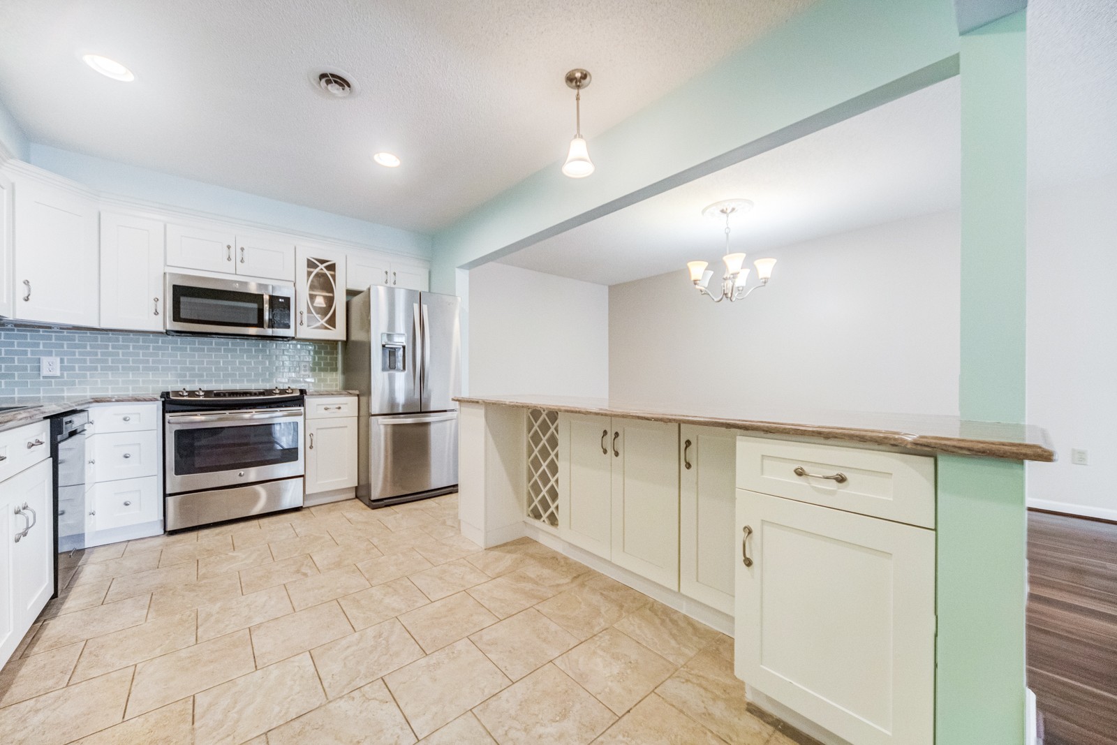 200 Sanders Ferry Road, Unit 1209 Hendersonville, TN 37075 - Photo 3 of 27 a kitchen with granite countertop a stove top oven and cabinets