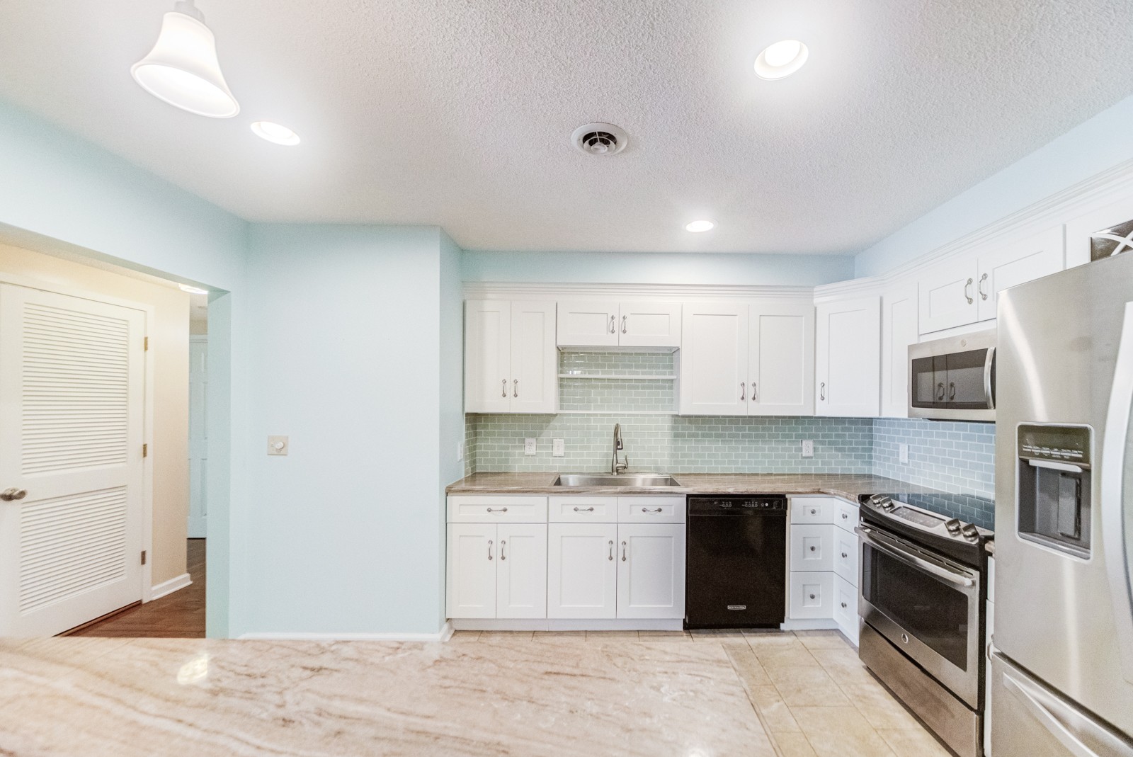 200 Sanders Ferry Road, Unit 1209 Hendersonville, TN 37075 - Photo 4 of 27 a kitchen with a sink a stove and cabinets