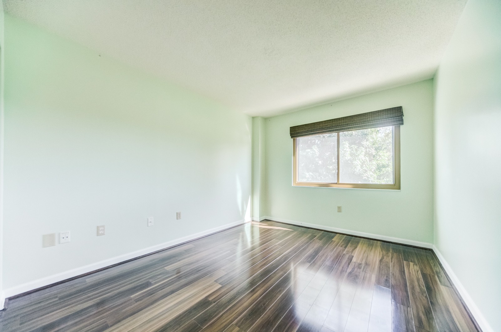 200 Sanders Ferry Road, Unit 1209 Hendersonville, TN 37075 - Photo 10 of 27 an empty room with wooden floor and windows