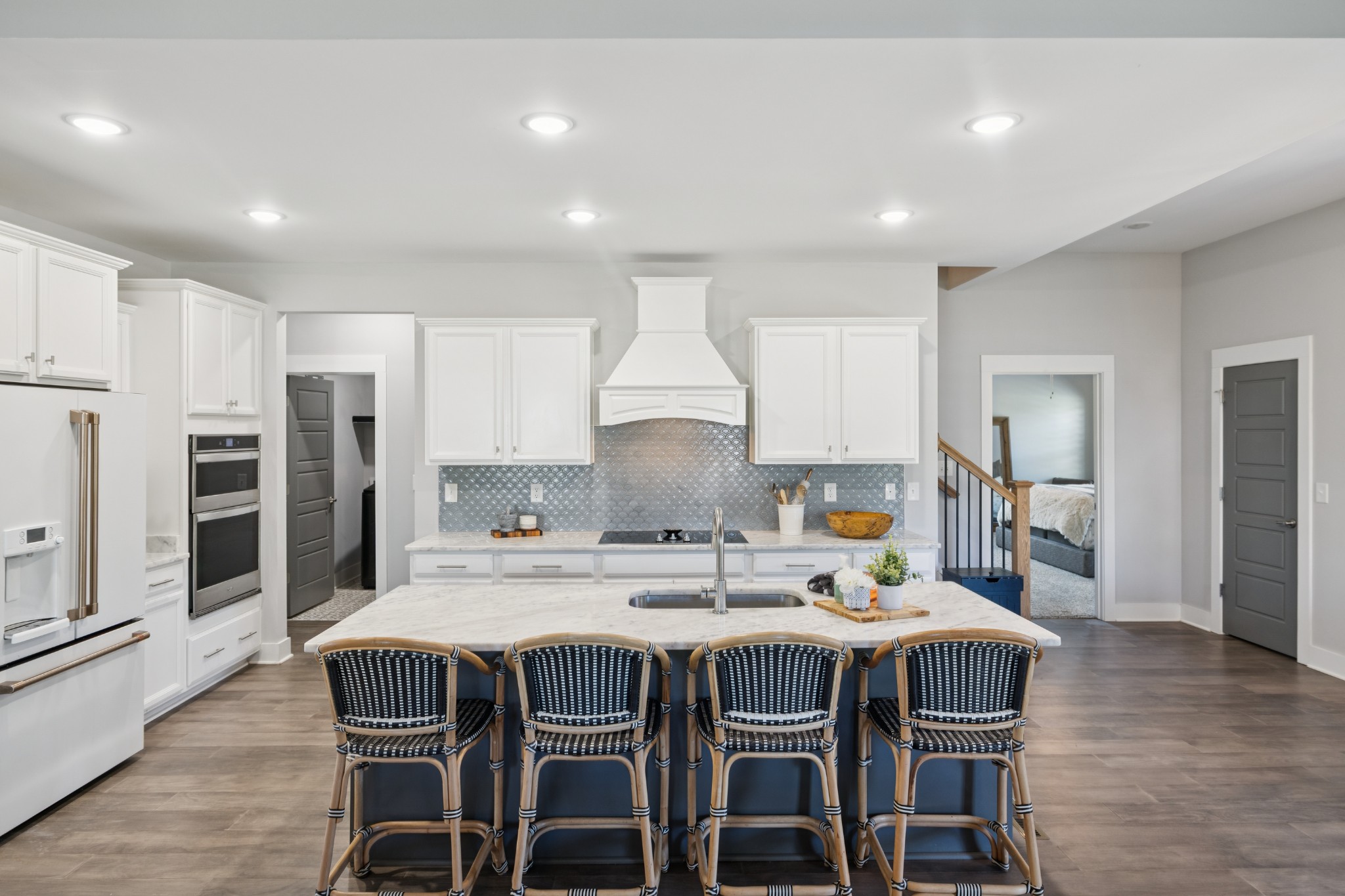12725 North Milton Road Milton, TN 37118 - Photo 16 of 54 a kitchen with a dining table chairs refrigerator and cabinets
