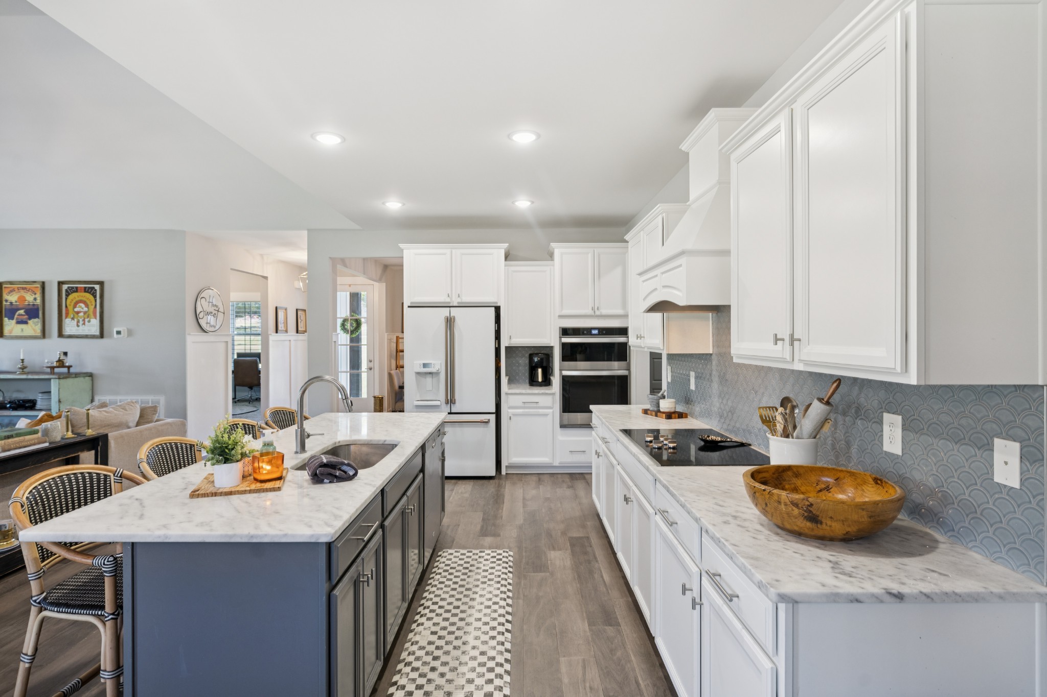 12725 North Milton Road Milton, TN 37118 - Photo 18 of 54 a kitchen with stainless steel appliances granite countertop a stove top oven a sink dishwasher and a refrigerator with wooden floor