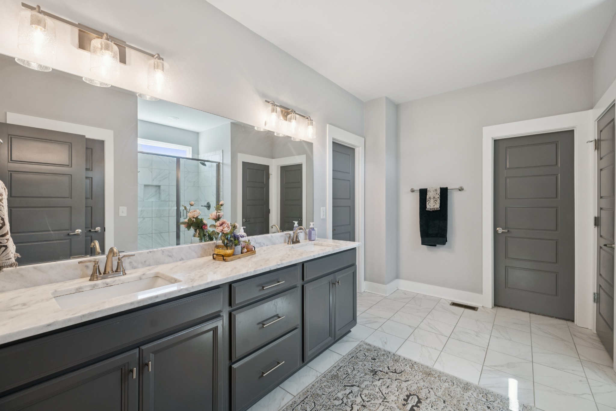 12725 North Milton Road Milton, TN 37118 - Photo 24 of 54 a bathroom with a double vanity sink mirror and shower
