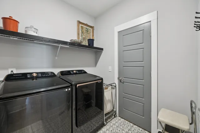 a kitchen with a sink cabinets and wooden floor