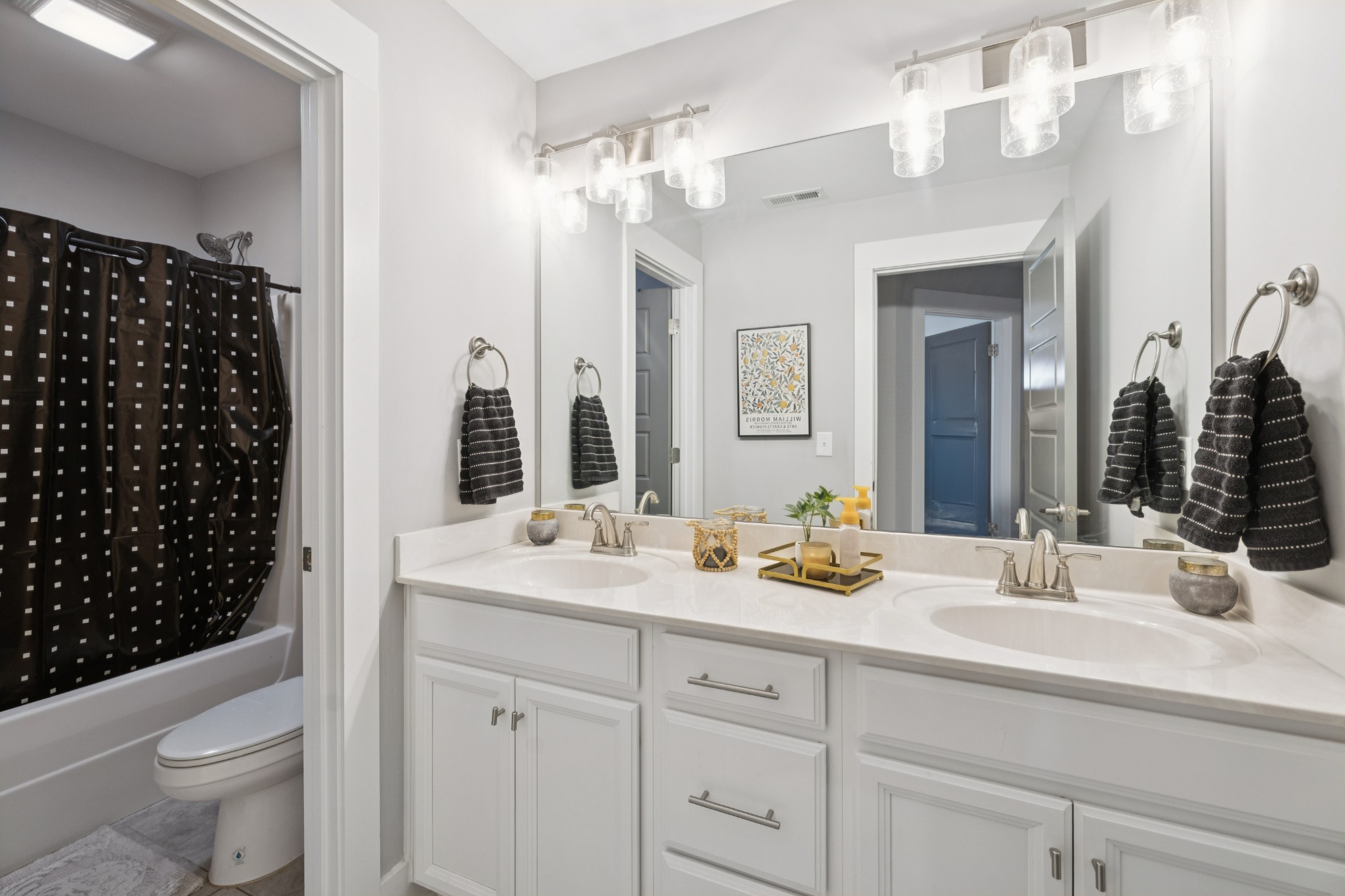 12725 North Milton Road Milton, TN 37118 - Photo 32 of 54 a bathroom with a double vanity sink toilet and shower