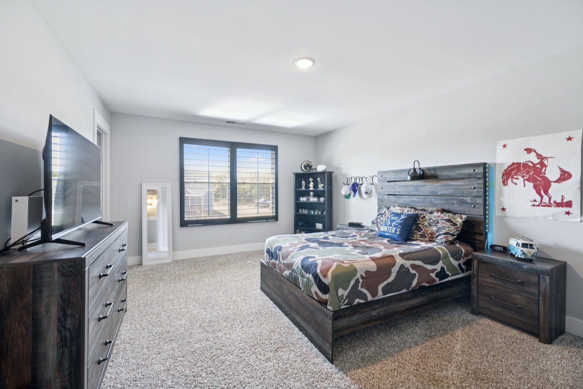 12725 North Milton Road Milton, TN 37118 - Photo 33 of 54 a bedroom with a bed and a flat screen tv