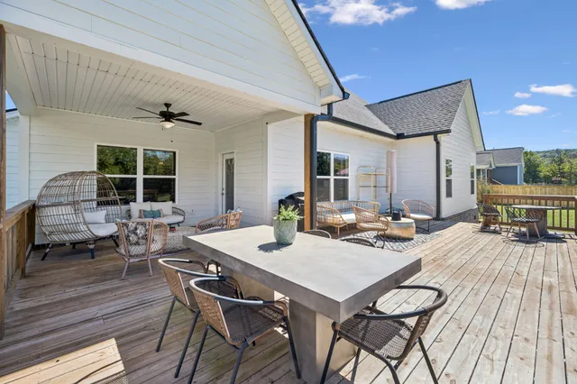a view of a patio with a table and chairs