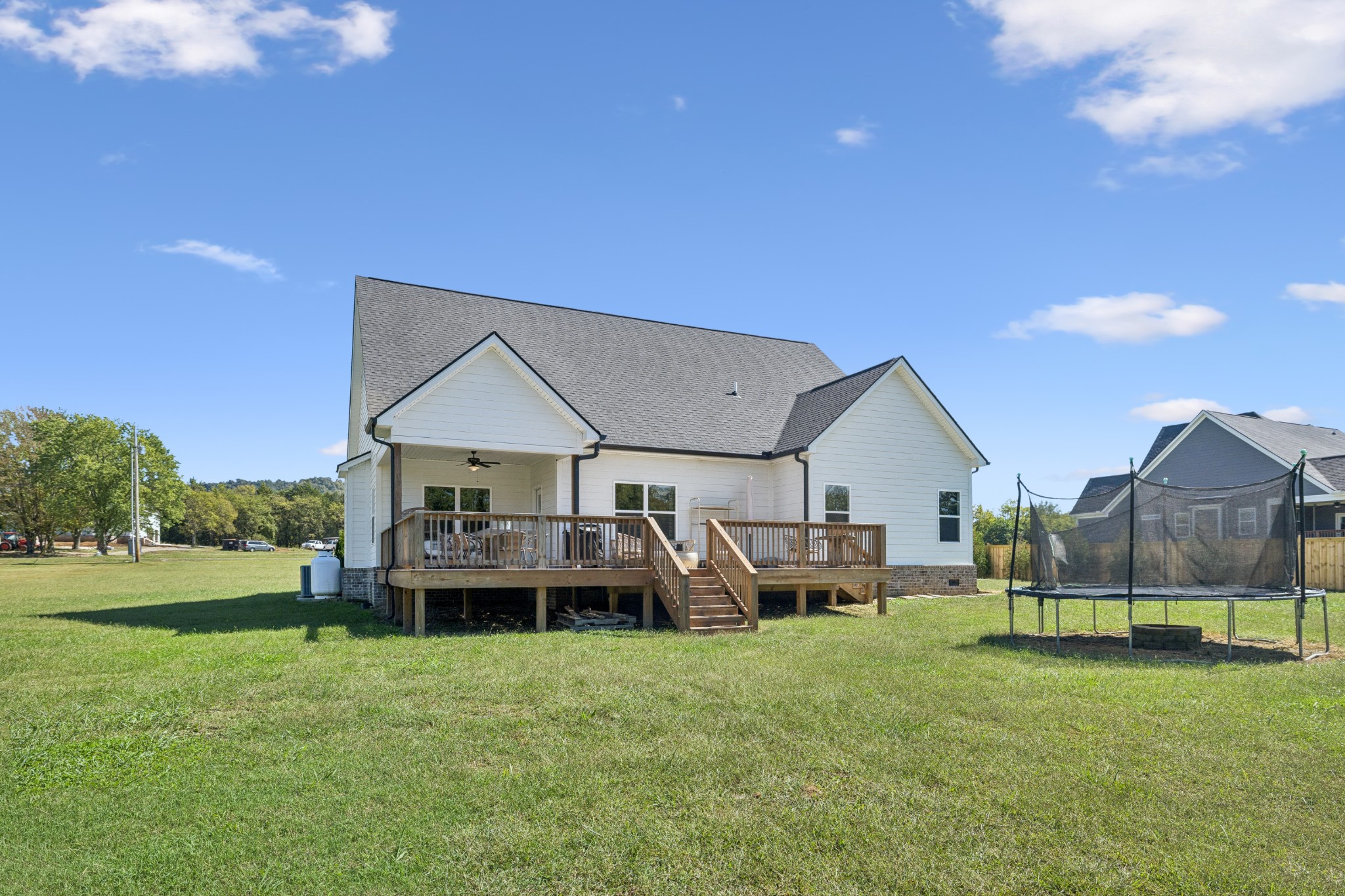 12725 North Milton Road Milton, TN 37118 - Photo 42 of 54 a view of a house with backyard and porch