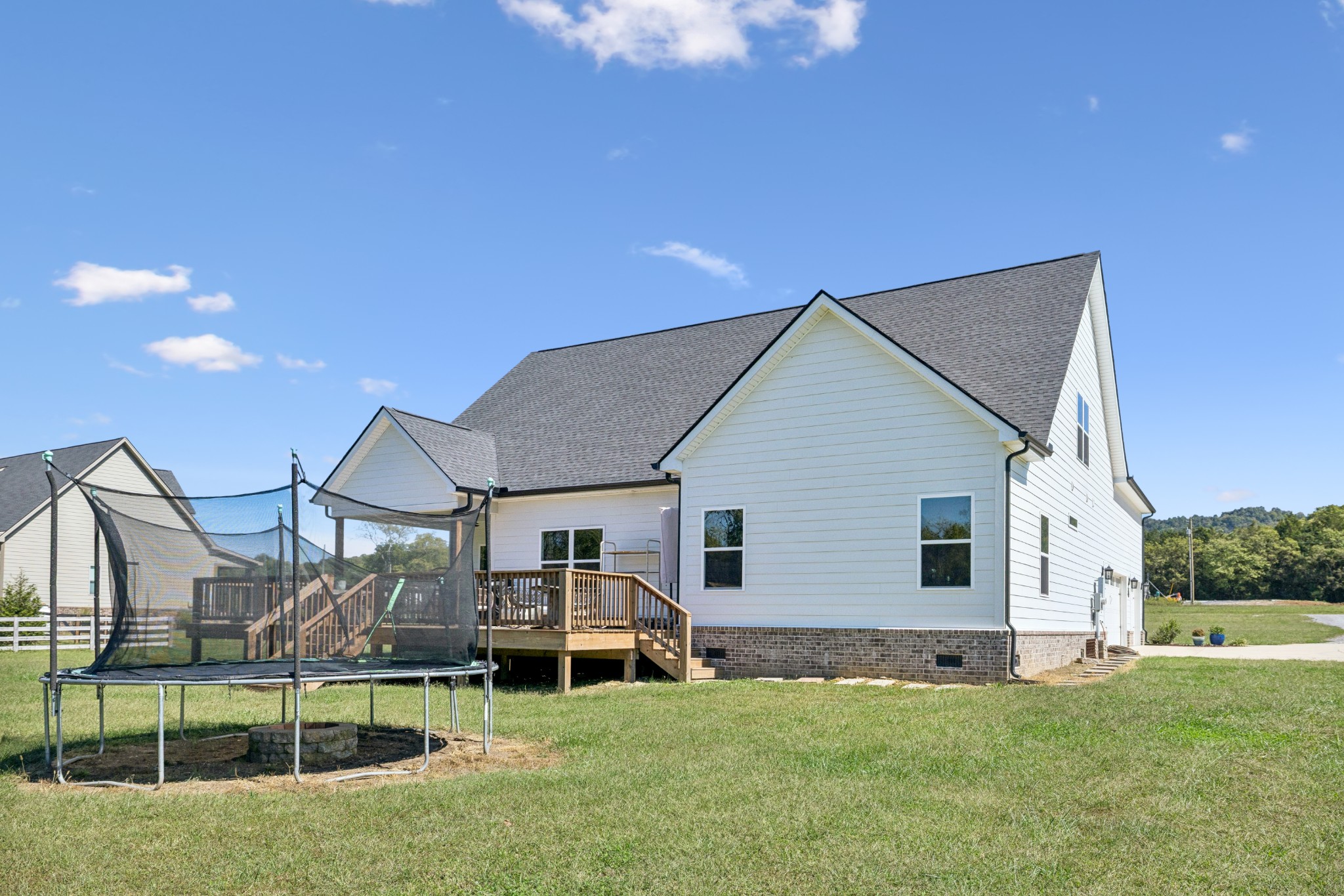12725 North Milton Road Milton, TN 37118 - Photo 43 of 54 a front view of a house with a yard and garage