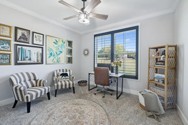 a view of a livingroom with workspace and a couch