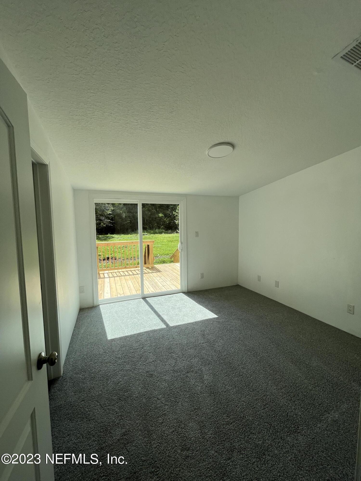 54291 Marlee Road Callahan, FL 32011 - Photo 3 of 7 a view of an empty room with a window