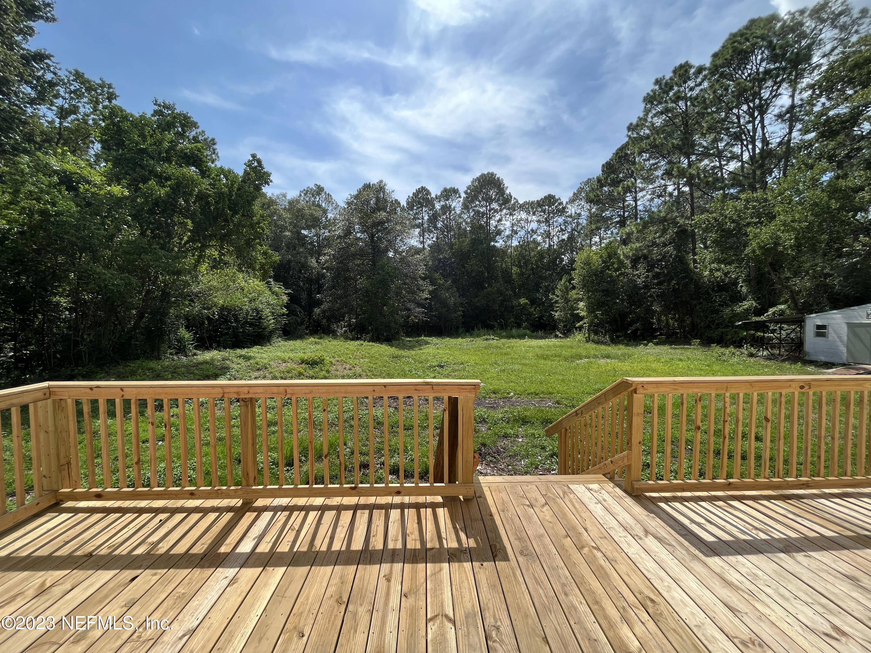 54291 Marlee Road Callahan, FL 32011 - Photo 7 of 7 a view of a swimming pool with a yard