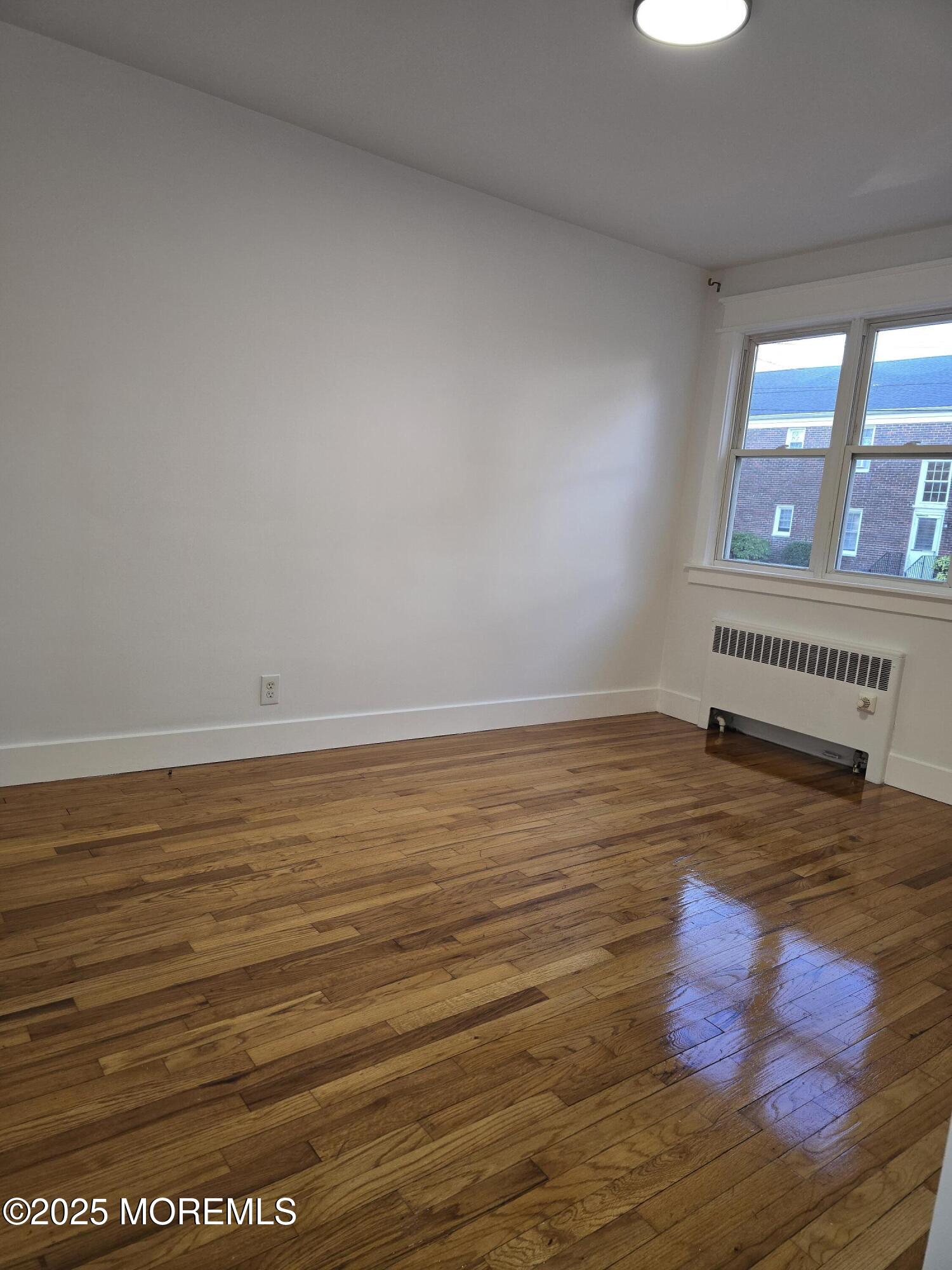142 South Street, Unit 10B Red Bank, NJ 07701 - Photo 5 of 9 a view of an empty room and window