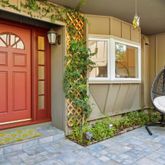 a front view of a house with garden