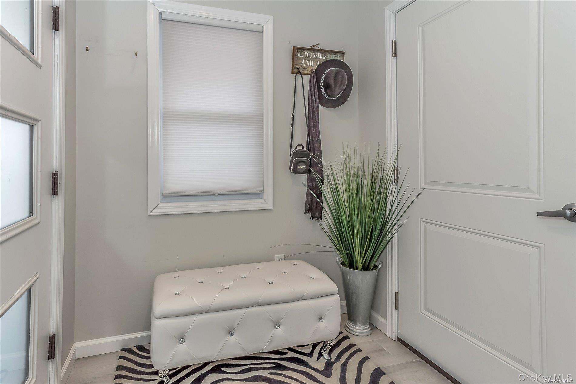 127 Maple Boulevard Long Beach, NY 11561 - Photo 2 of 22 a bathroom with a toilet and a sink
