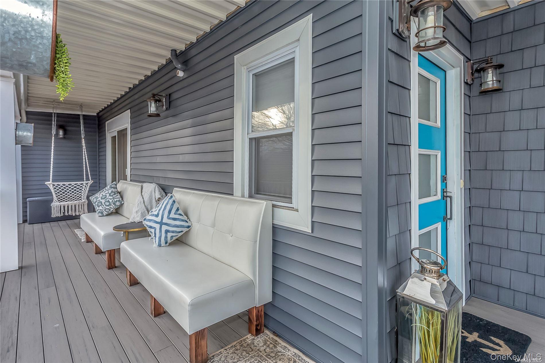 127 Maple Boulevard Long Beach, NY 11561 - Photo 21 of 22 a view of a deck with couches and wooden floor