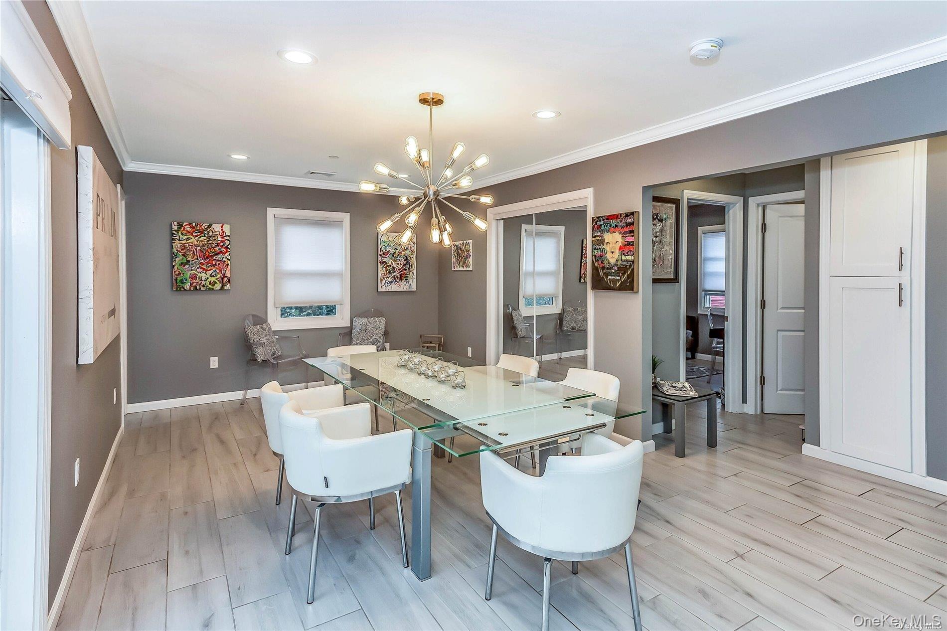 127 Maple Boulevard Long Beach, NY 11561 - Photo 8 of 22 a view of a dining room with furniture and wooden floor