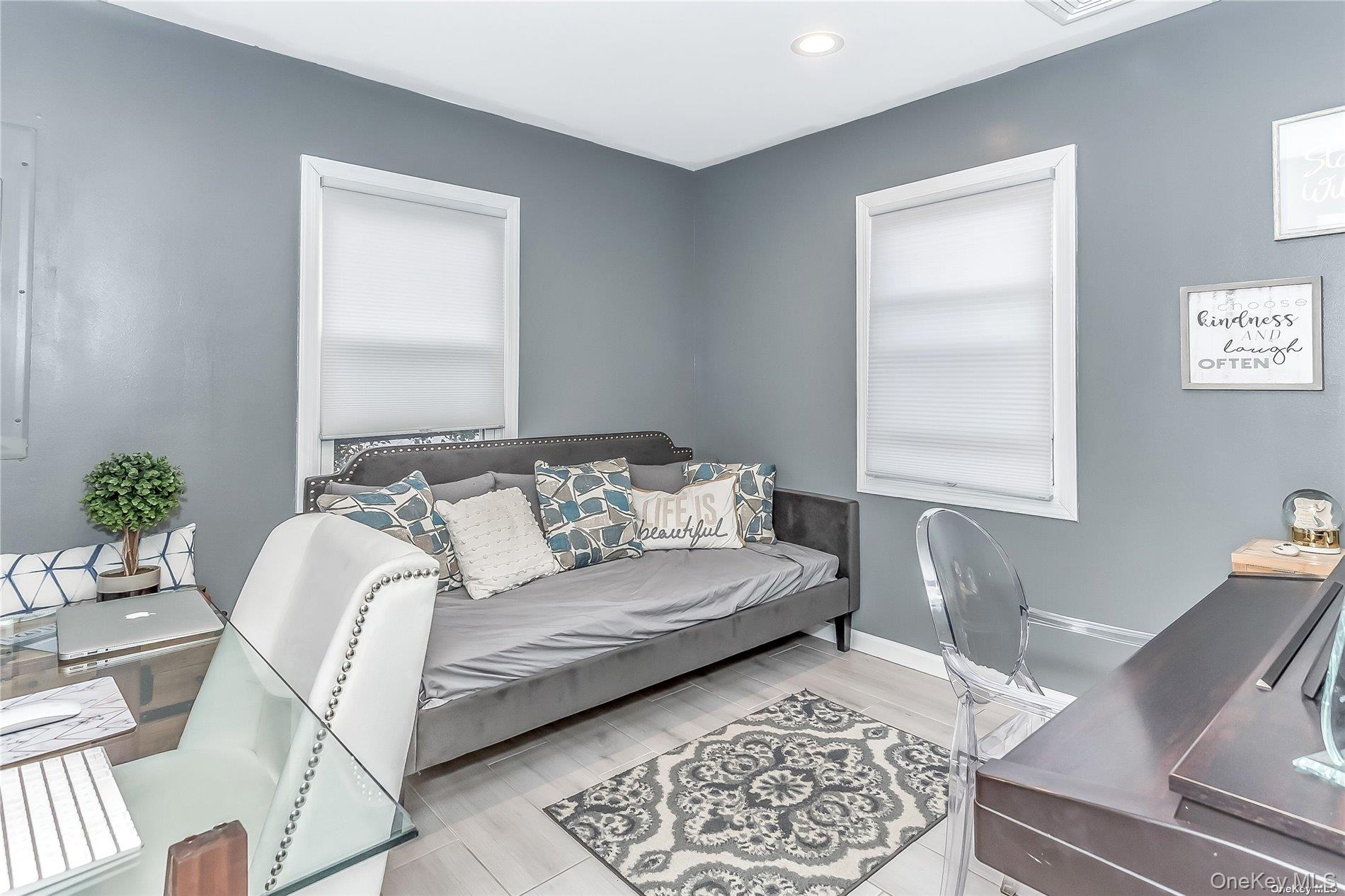 127 Maple Boulevard Long Beach, NY 11561 - Photo 10 of 22 a living room with a couch and a potted plant