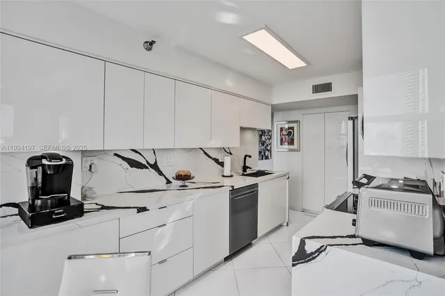 a bedroom with a large bed and a painting on the wall