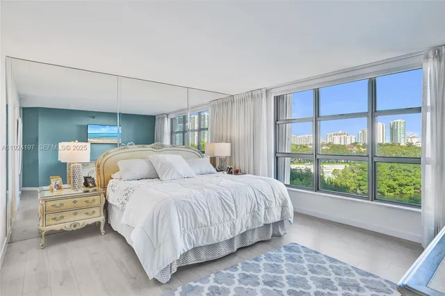 a bedroom with a bed and a night stand