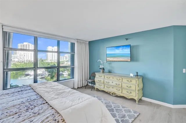 a bedroom with a bed and a couch