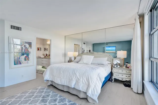 a bathroom with a sink a mirror and vanity