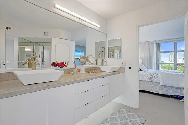 a bathroom with sinks and mirror
