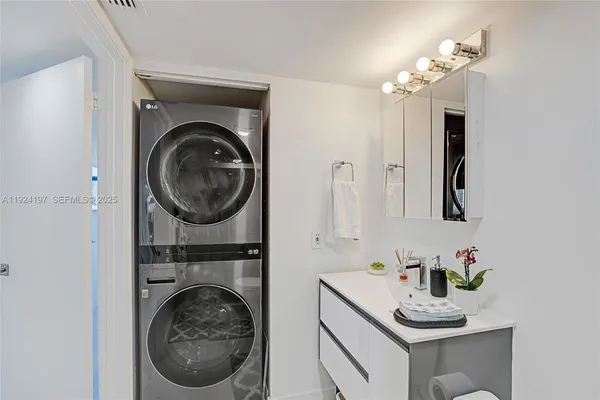 a bathroom with a sink a mirror and vanity