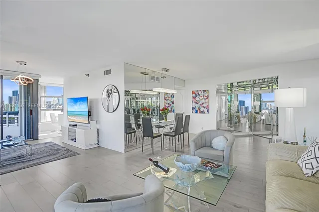 a kitchen with stainless steel appliances a refrigerator sink and stove