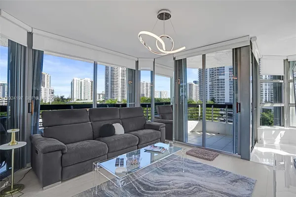 a living room with furniture and a large window