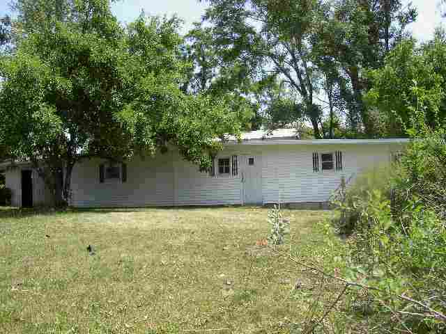 77 North Dakota Road Ridott, IL 61067 - Photo 2 of 8 a view of a house with a large tree and a yard