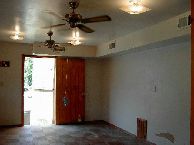 77 North Dakota Road Ridott, IL 61067 - Photo 3 of 8 a view of a hallway with a chandelier
