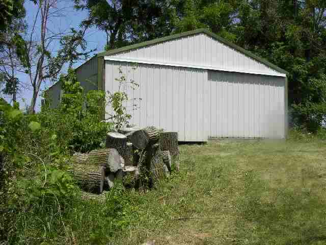 77 North Dakota Road Ridott, IL 61067 - Photo 7 of 8 a backyard of a house with lots of green space